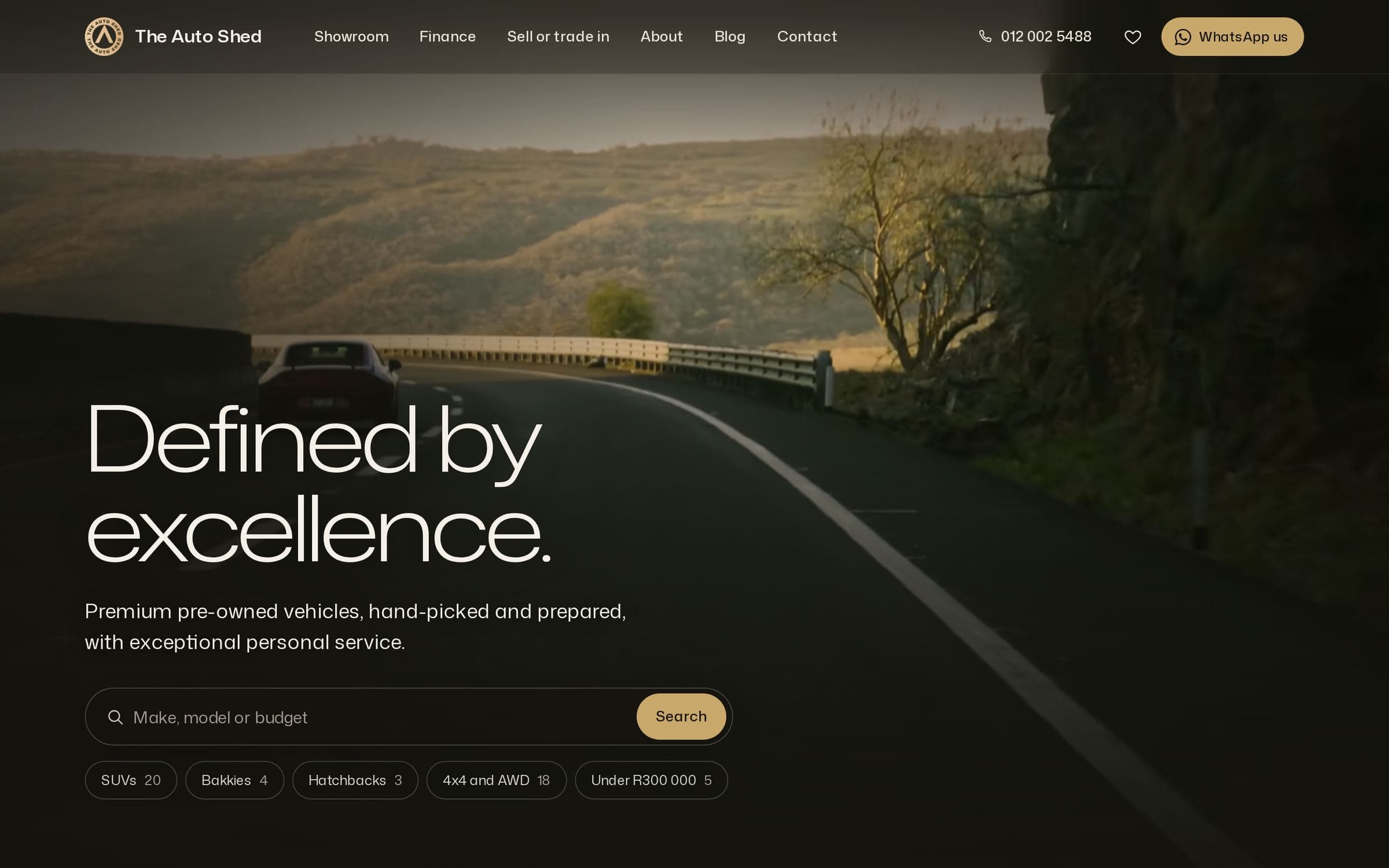 The Auto Shed's website on a laptop