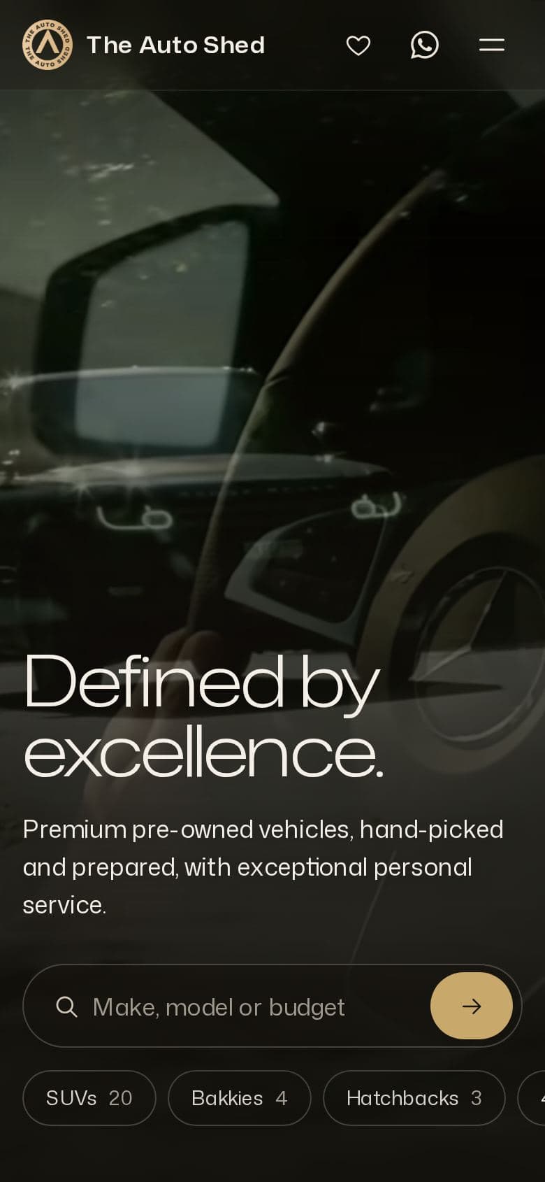 The Auto Shed's website on a phone